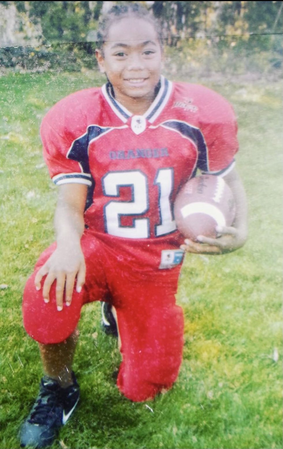 Image - Young Jaylen Warren posing for the camera after a match in elementary school. 