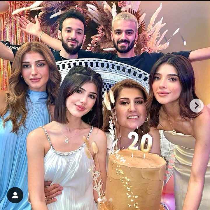 Image - Cedraʼs Beauty in a family photo with her mother, Khlat Mustafa; two sisters, Narin and Sherin; and two brothers, Shero and Jalal, on her 20th birthday celebration party in September 2022.