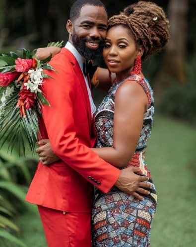 Image - Somara Theodore with her husband, Carl C. Scott, in a Hawaiian-themed wedding picture. 