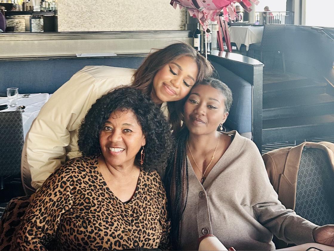 Simone Theodore in a cute lil family photo with her two older sisters, Jacinth and Somara Theodore. 